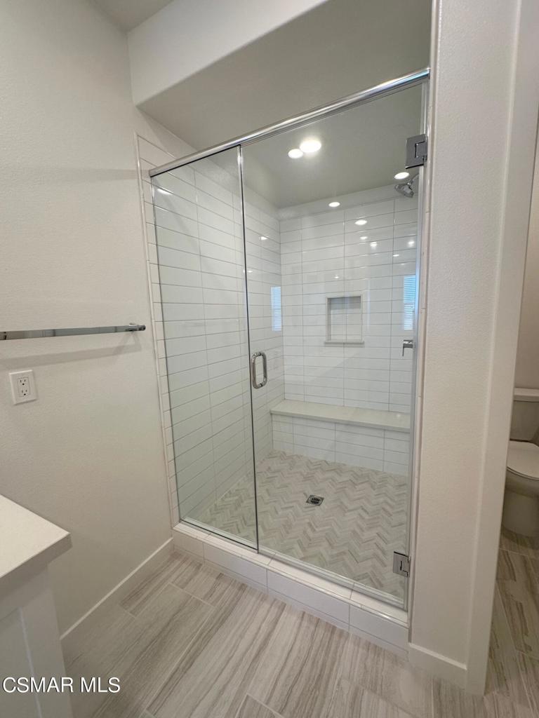 10726 Telegraph Road Ventura, CA 93004 - Photo 10 of 25 a bathroom with a glass shower door