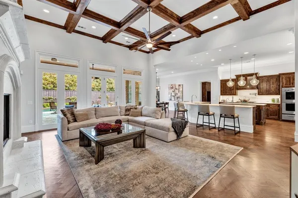 a large kitchen with stainless steel appliances granite countertop a stove and a sink