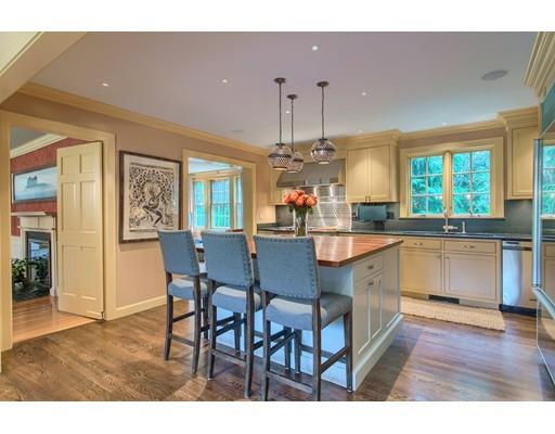 37 Garland Road Concord, MA 01742 - Photo 11 of 33 a kitchen with kitchen island granite countertop a sink cabinets and wooden floor
