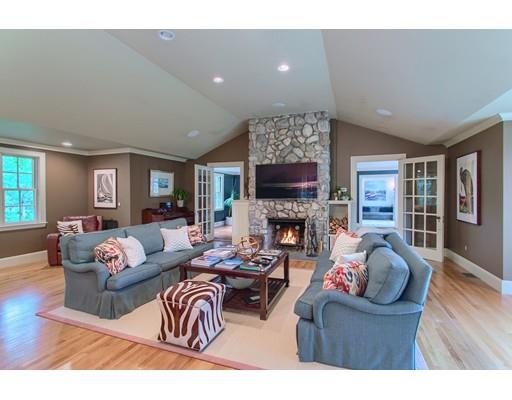 37 Garland Road Concord, MA 01742 - Photo 19 of 33 a living room with furniture a fireplace and a flat screen tv