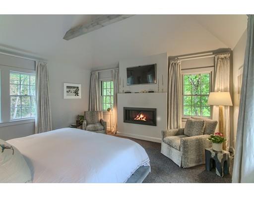 37 Garland Road Concord, MA 01742 - Photo 23 of 33 a bedroom with furniture and a fireplace