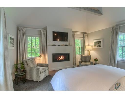 37 Garland Road Concord, MA 01742 - Photo 24 of 33 a bedroom with a bed and a fireplace