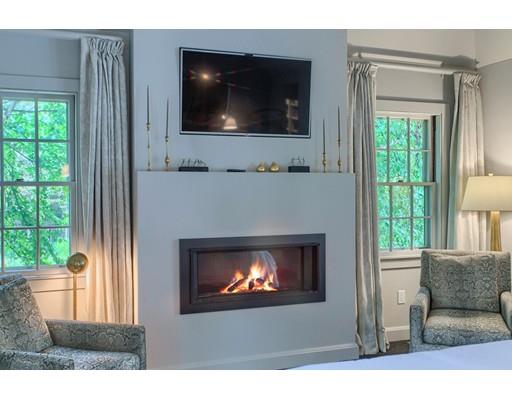 37 Garland Road Concord, MA 01742 - Photo 25 of 33 a living room with a fireplace and a flat screen tv