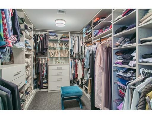 37 Garland Road Concord, MA 01742 - Photo 27 of 33 a view of walk in closet with clothes and shoes