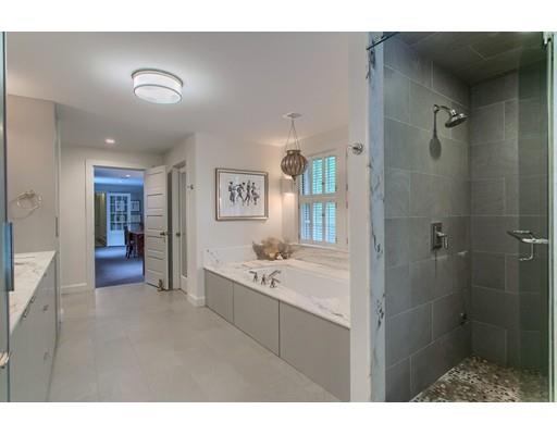 37 Garland Road Concord, MA 01742 - Photo 28 of 33 a bathroom with a sink a mirror and a bathtub