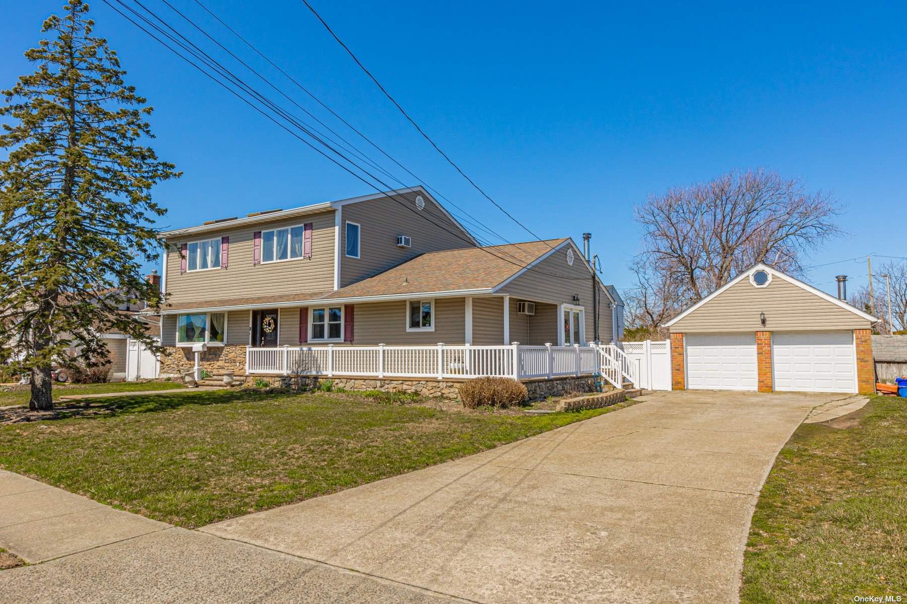 16 East Saltaire Road Lindenhurst, NY 11757 - Photo 1 of 1 a front view of a house with a yard