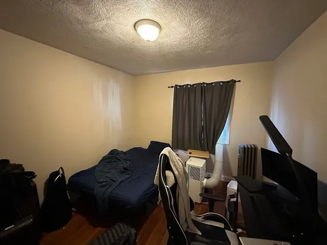 a view of workspace with wooden floor windows