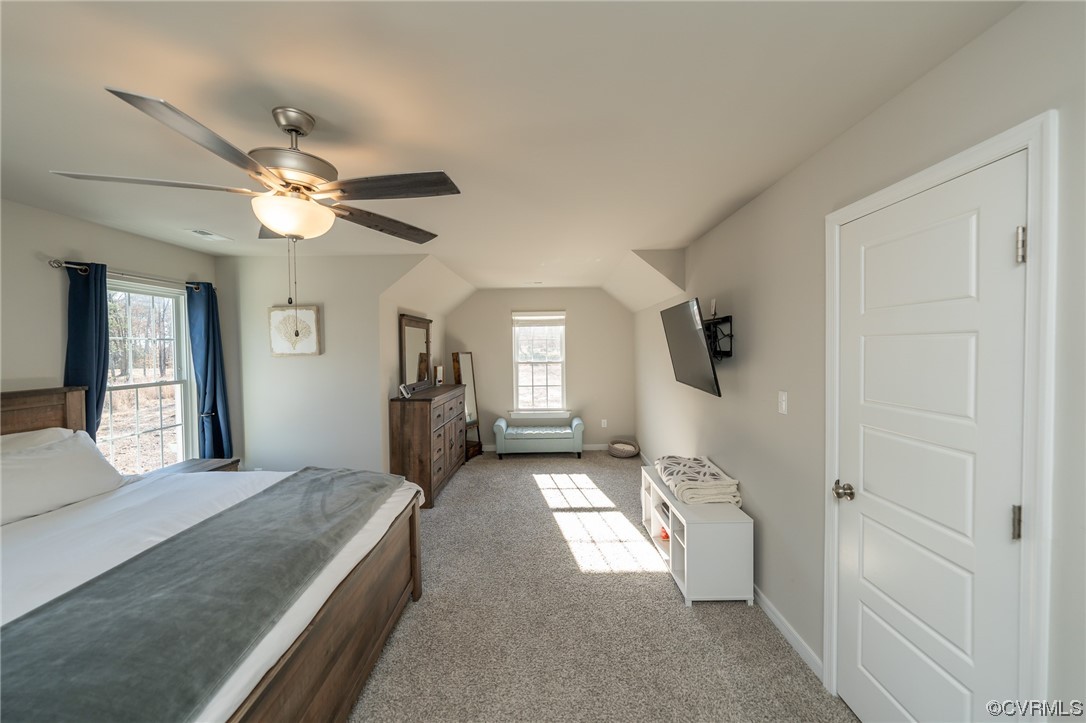 1147 Courthouse Road Palmyra, VA 22963 - Photo 13 of 48 a spacious bedroom with a bed and a chandelier