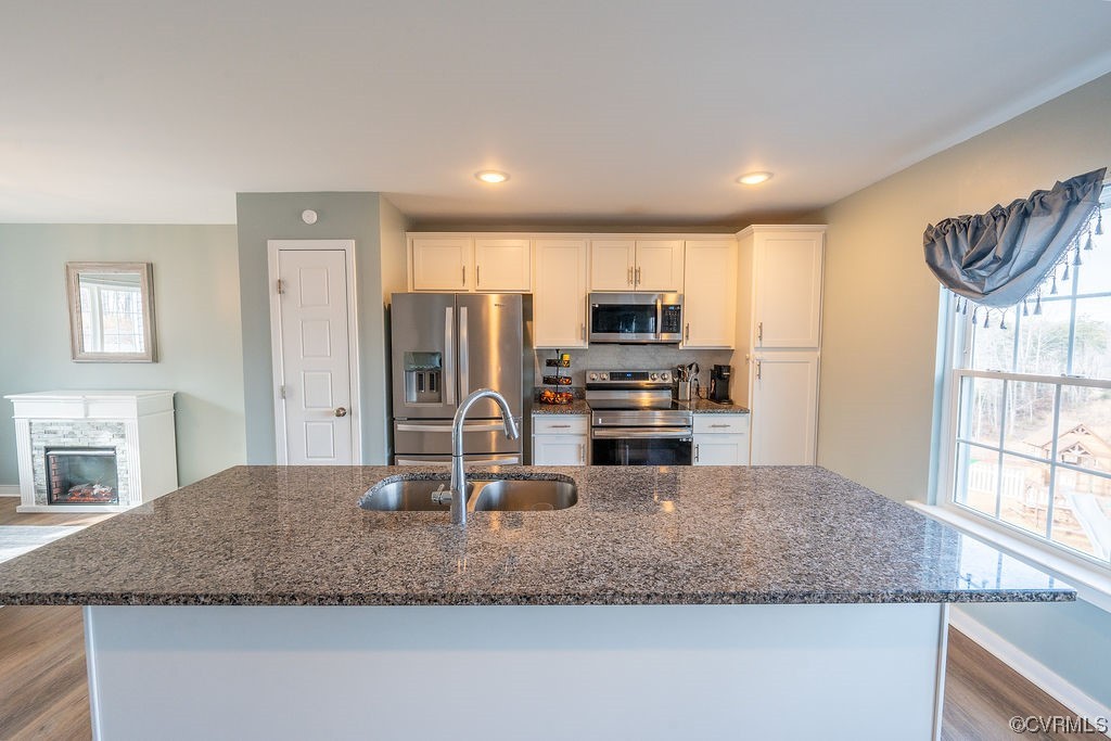 1147 Courthouse Road Palmyra, VA 22963 - Photo 5 of 48 a kitchen with stainless steel appliances granite countertop a sink stove and refrigerator