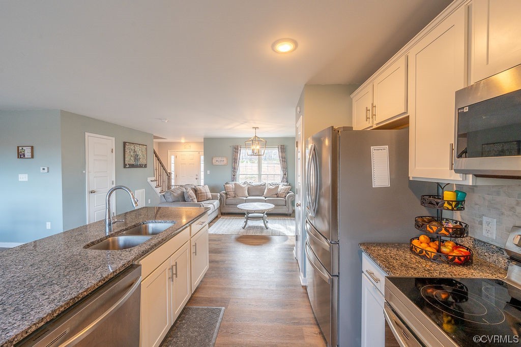 1147 Courthouse Road Palmyra, VA 22963 - Photo 6 of 48 a kitchen with granite countertop lots of counter top space and stainless steel appliances