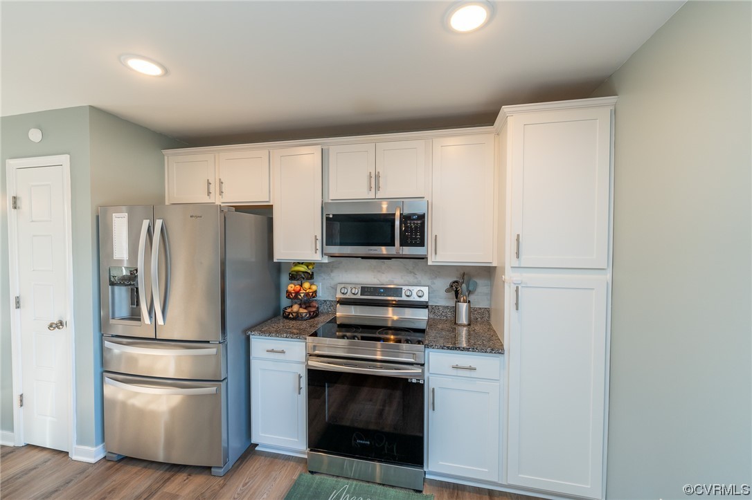 1147 Courthouse Road Palmyra, VA 22963 - Photo 7 of 48 a kitchen with stainless steel appliances a refrigerator stove and microwave