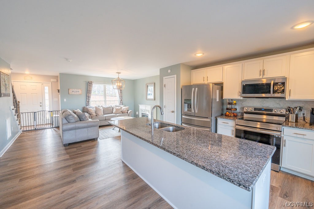 1147 Courthouse Road Palmyra, VA 22963 - Photo 8 of 48 a large kitchen with kitchen island a large counter top space a sink stainless steel appliances and cabinets