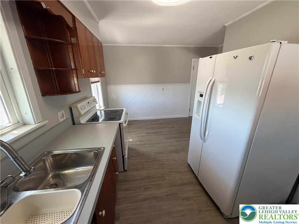 424 West Main Street Bath, PA 18014 - Photo 11 of 30 a kitchen with a refrigerator and a sink