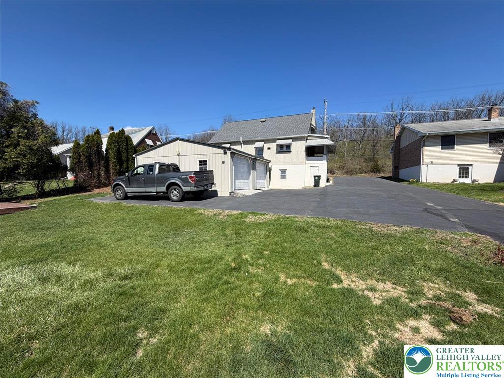424 West Main Street Bath, PA 18014 - Photo 21 of 30 a view of a house with a yard and sitting area