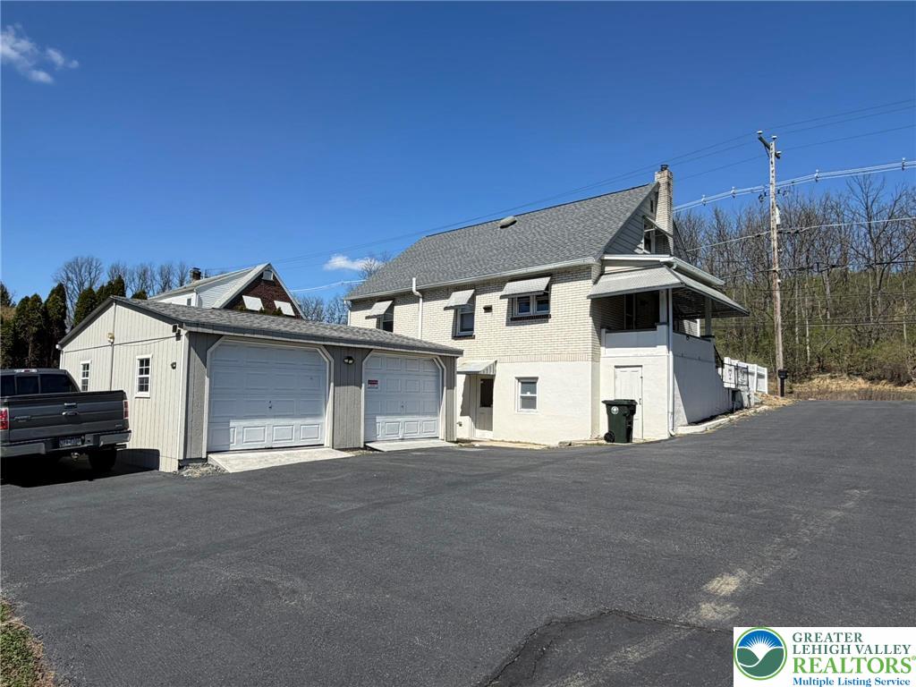 424 West Main Street Bath, PA 18014 - Photo 23 of 30 a front view of a house with a garage