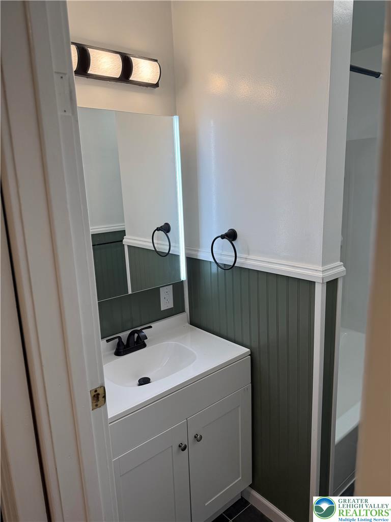 424 West Main Street Bath, PA 18014 - Photo 28 of 30 a bathroom with a sink and mirror