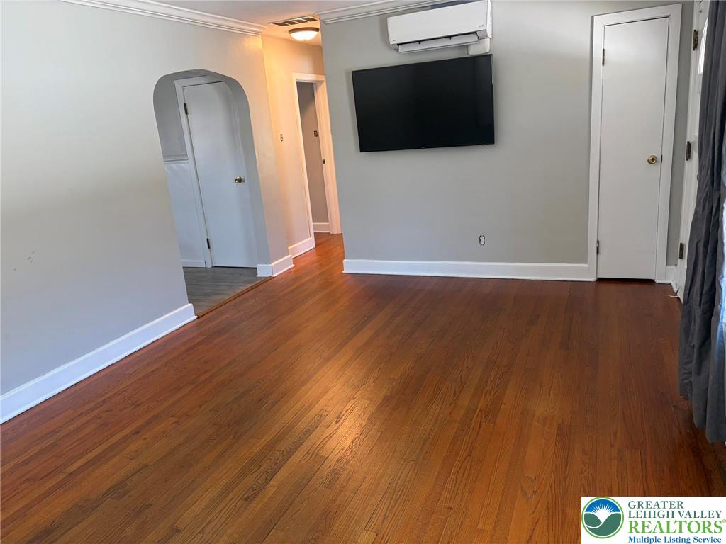424 West Main Street Bath, PA 18014 - Photo 6 of 30 a view of a livingroom with wooden floor and a flat screen tv
