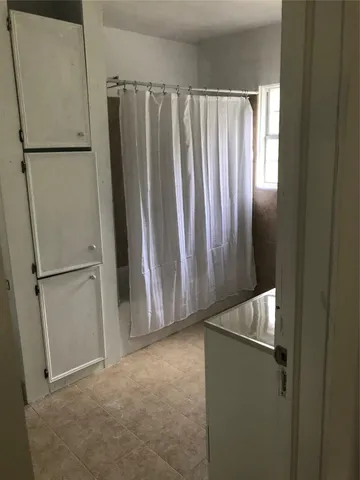 a view of a refrigerator in kitchen