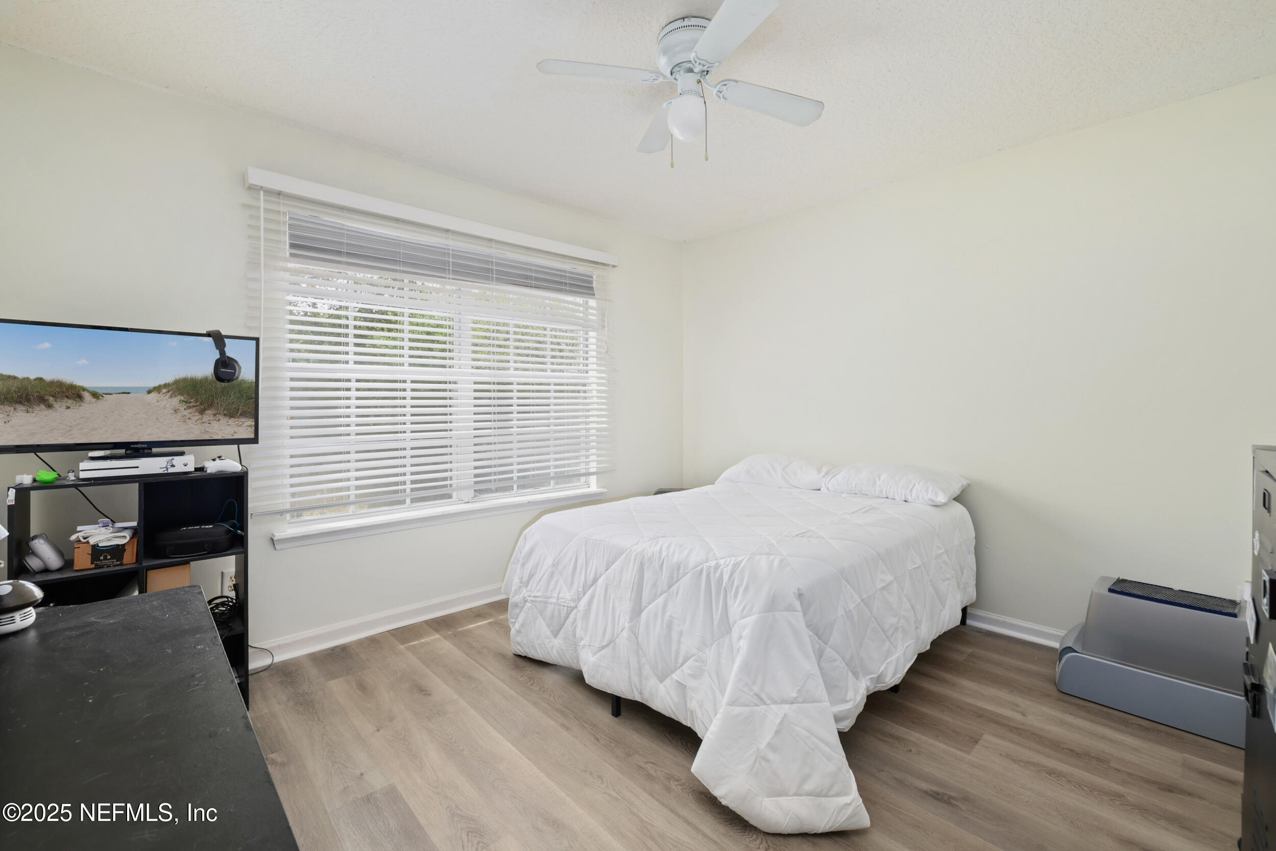 1256 Splendid Ravine Street St. Augustine, FL 32092 - Photo 18 of 36 a bed sitting in a room next to a window