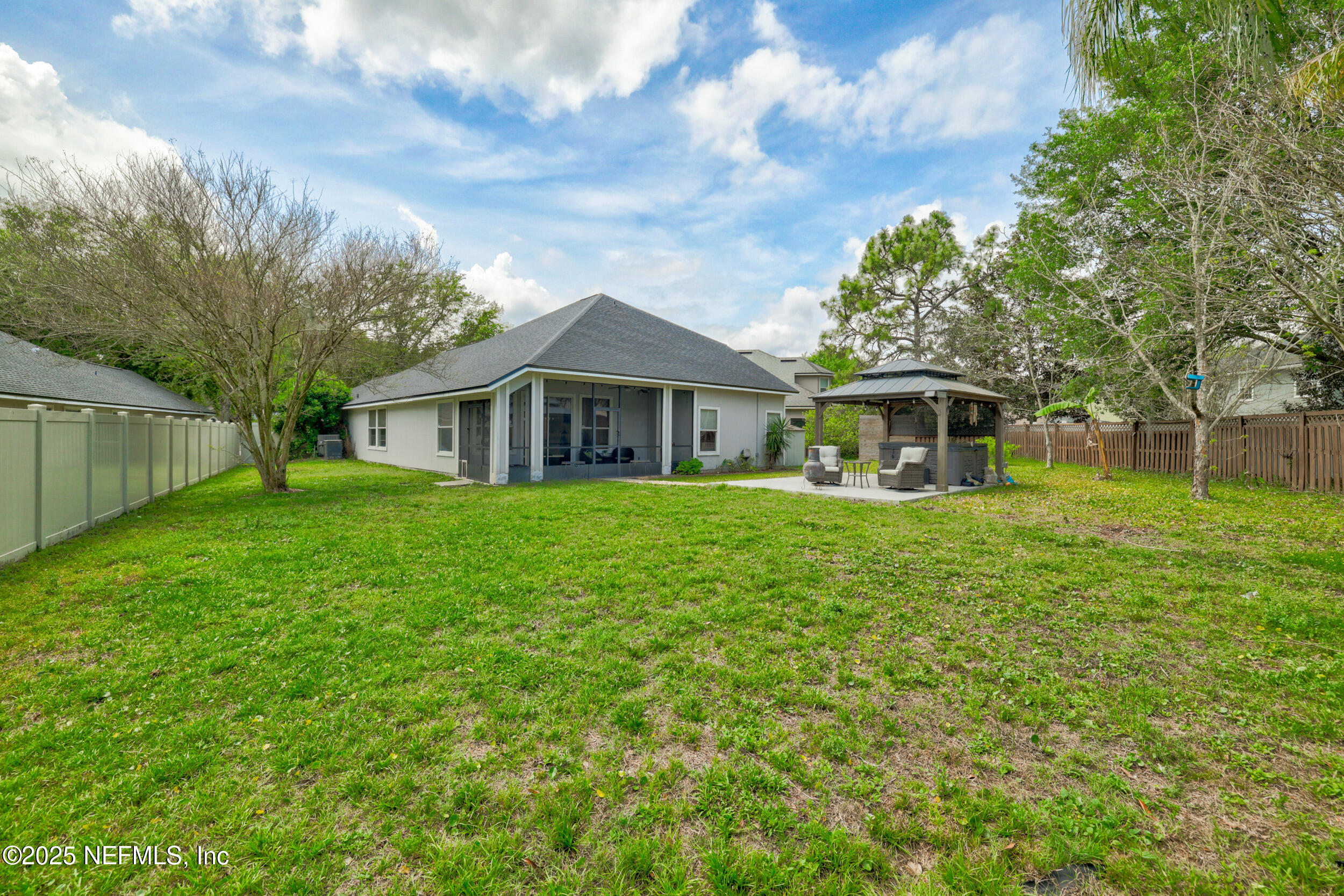 1256 Splendid Ravine Street St. Augustine, FL 32092 - Photo 22 of 36 a front view of a house with a garden