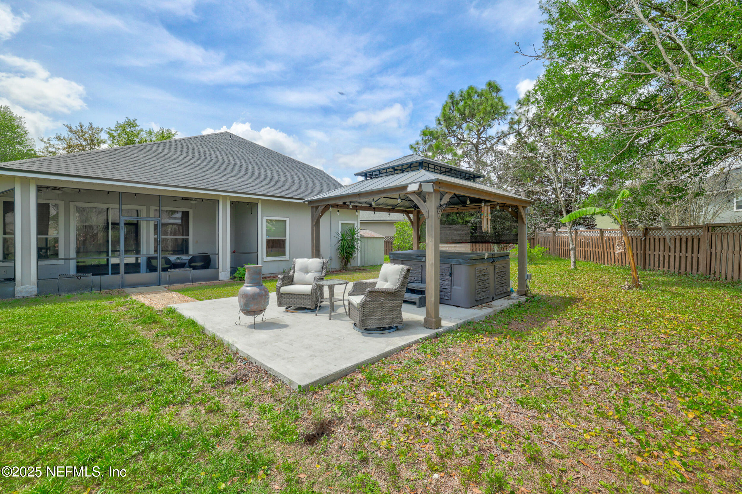 1256 Splendid Ravine Street St. Augustine, FL 32092 - Photo 23 of 36 a view of a house with backyard sitting area and garden