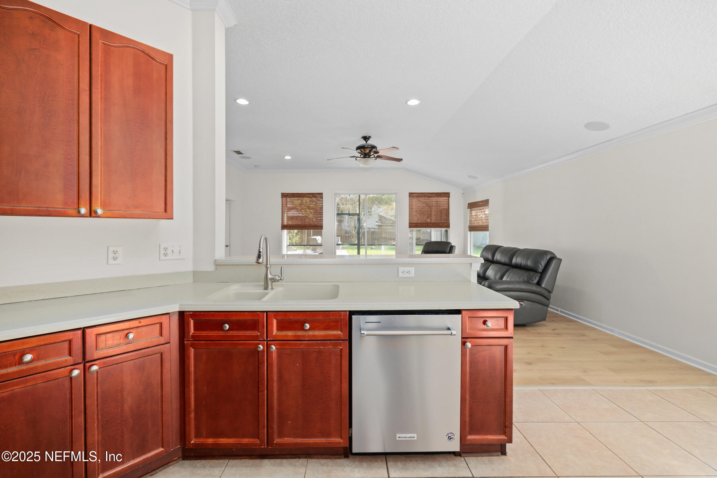 1256 Splendid Ravine Street St. Augustine, FL 32092 - Photo 36 of 36 a kitchen with stainless steel appliances granite countertop a sink and a cabinets