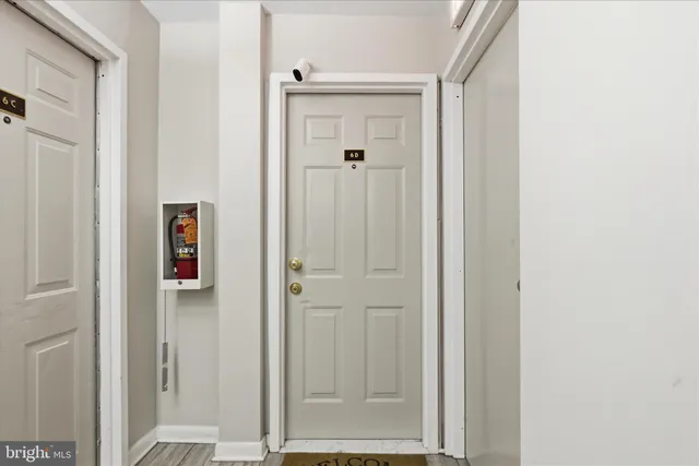 a view of a bathroom with a shower and a door