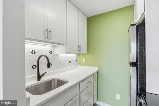 a close view of a sink and a vanity in the bathroom