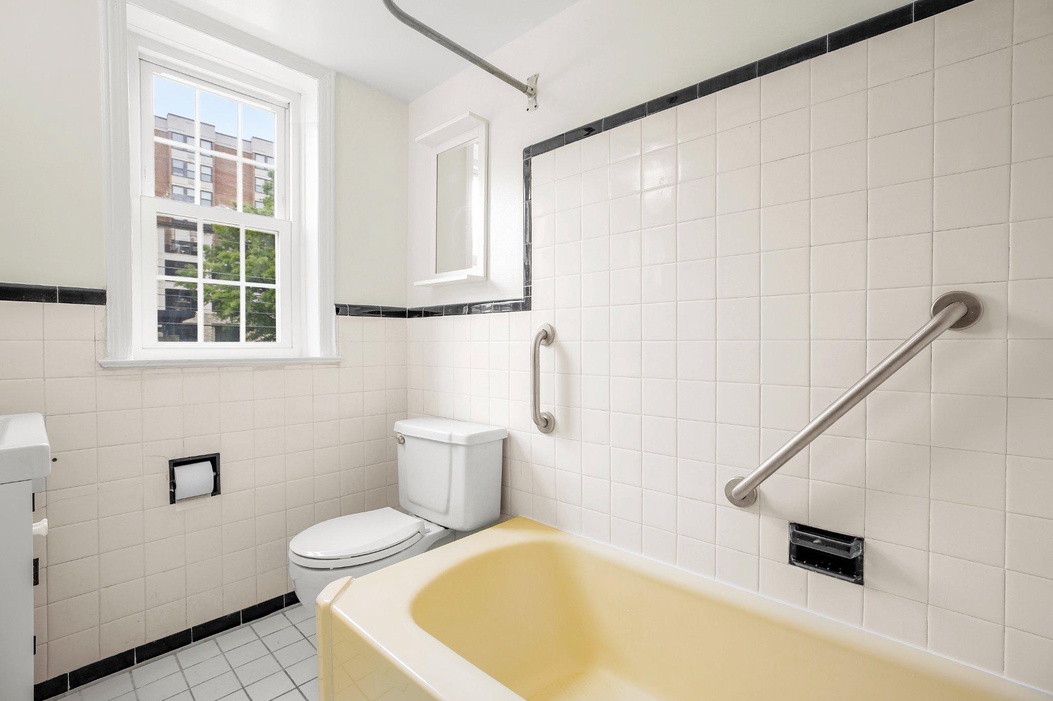 2202 Colston Drive, Unit 102 Silver Spring, MD 20910 - Photo 21 of 38 a bathroom with a sink and a bathtub