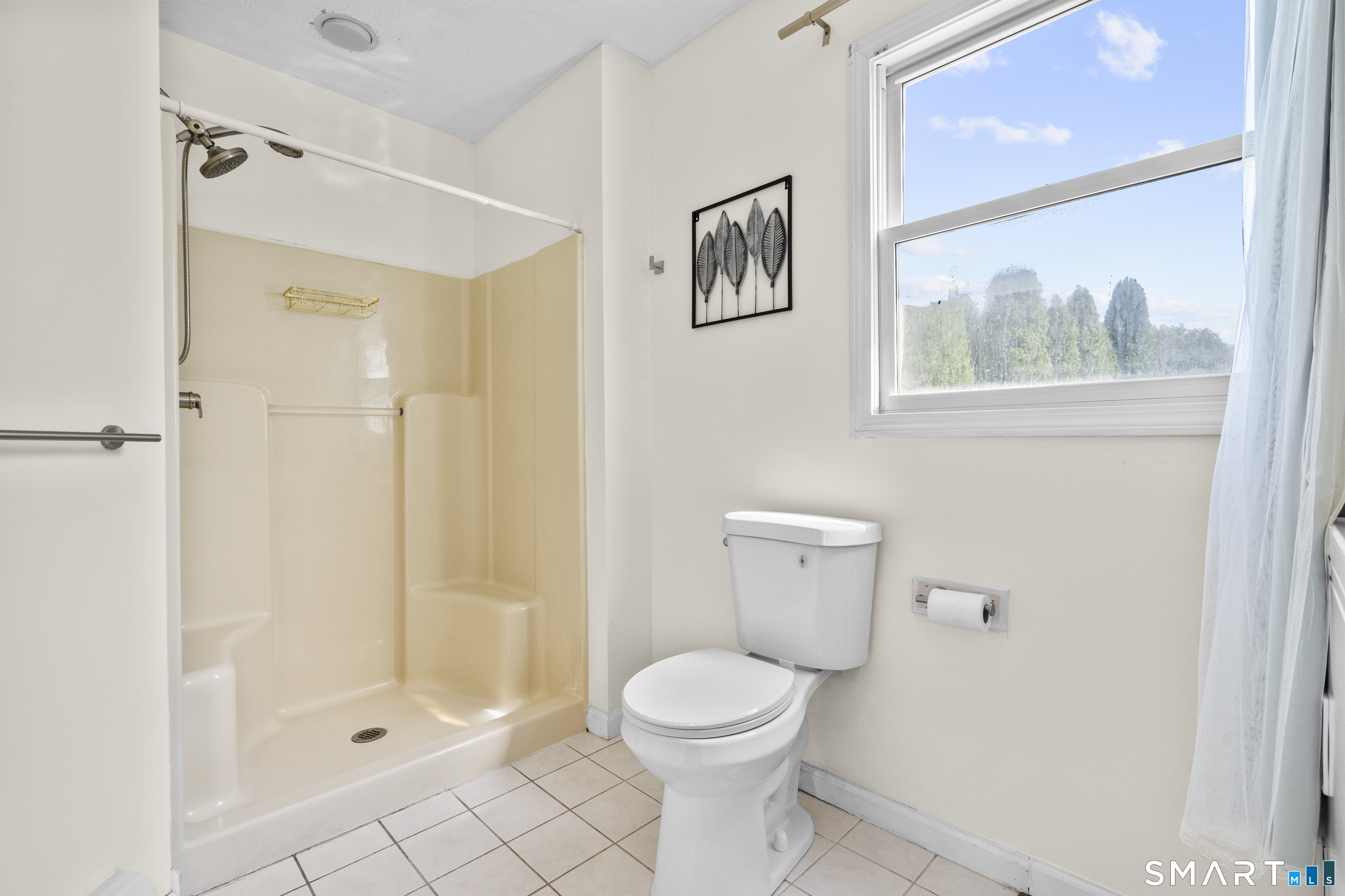 39 Joseph Lane Hamden, CT 06514 - Photo 24 of 40 a bathroom with a toilet and a shower