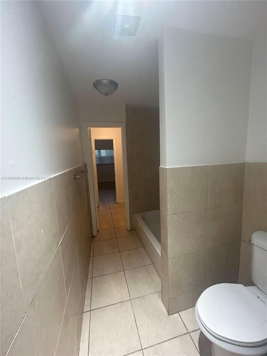 3876 Northwest 207 St Road, Unit 3876 Miami Gardens, FL 33055 - Photo 15 of 22 a bathroom with a toilet