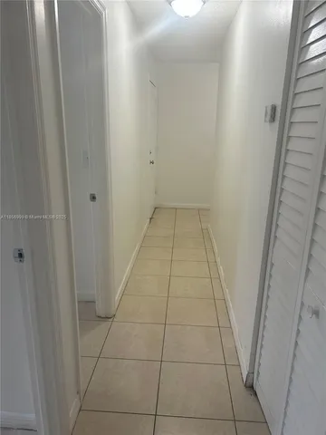 an empty room with a bench