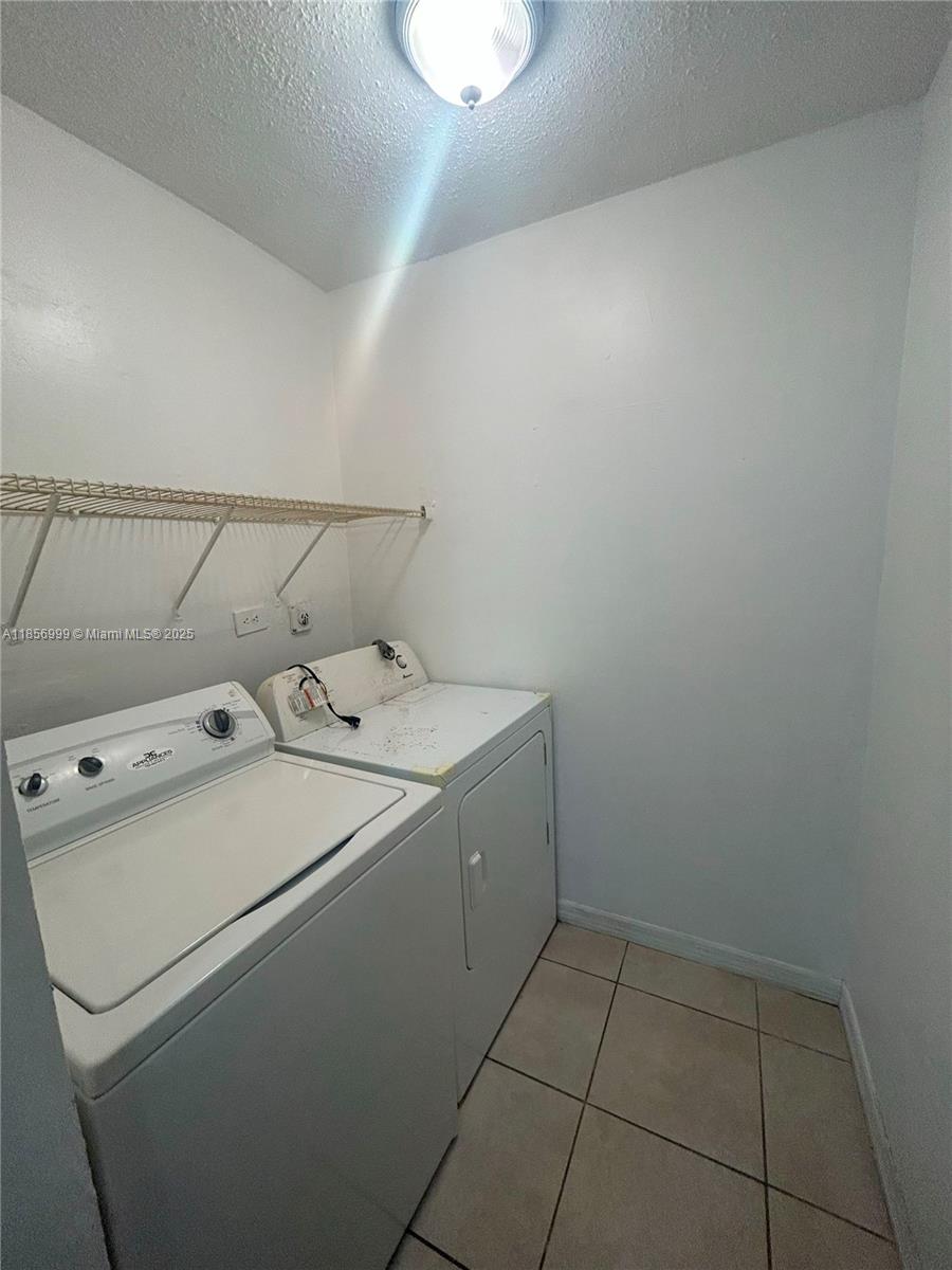 3876 Northwest 207 St Road, Unit 3876 Miami Gardens, FL 33055 - Photo 6 of 22 a utility room with dryer and washer