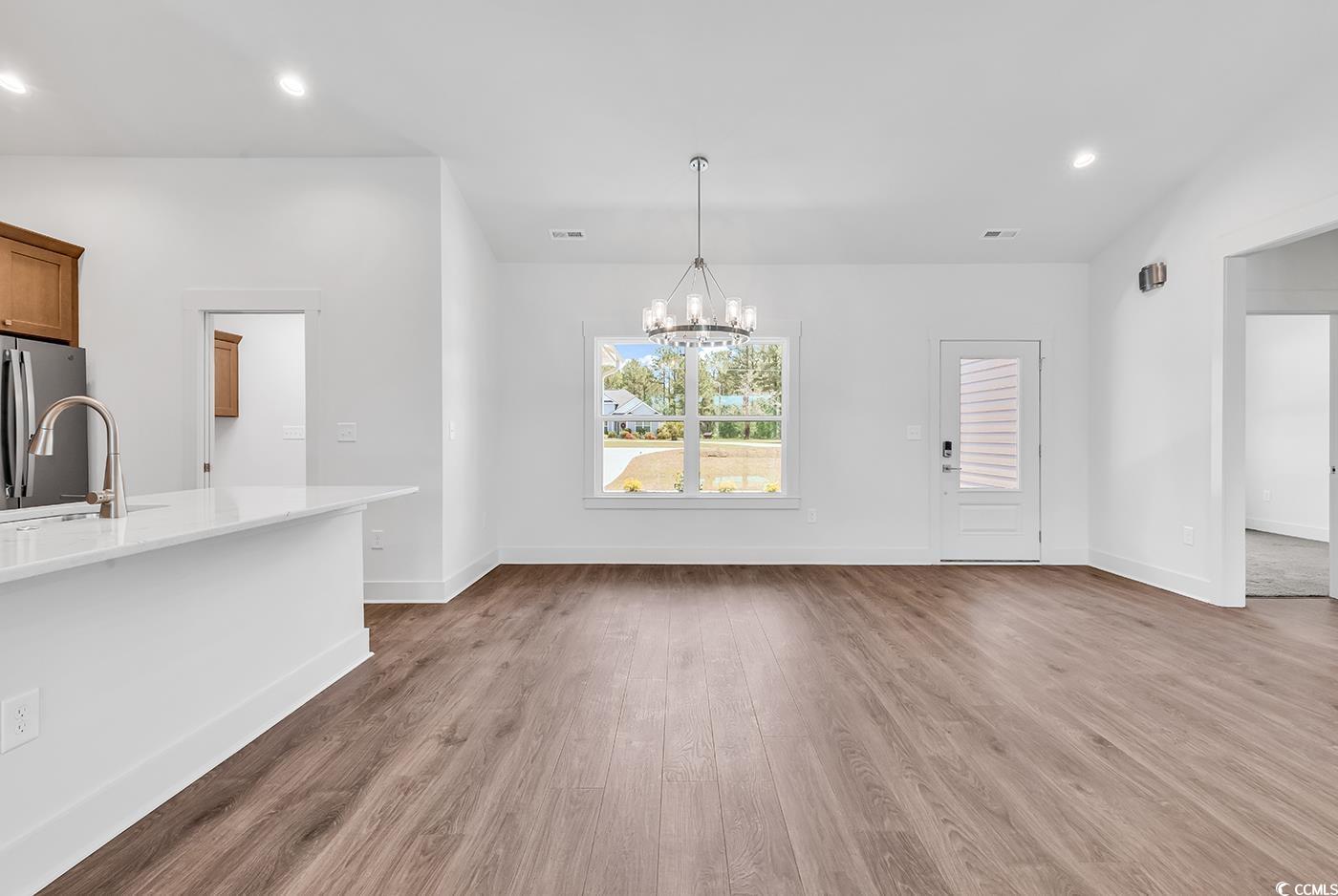 718 Highway 348 Loris, SC 29569 - Photo 12 of 28 Dining area with chandelier