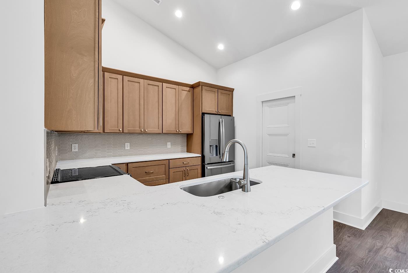 718 Highway 348 Loris, SC 29569 - Photo 13 of 28 Kitchen with tile backsplash, quartz countertops, stainless steel appliances, and a single-bowl sink