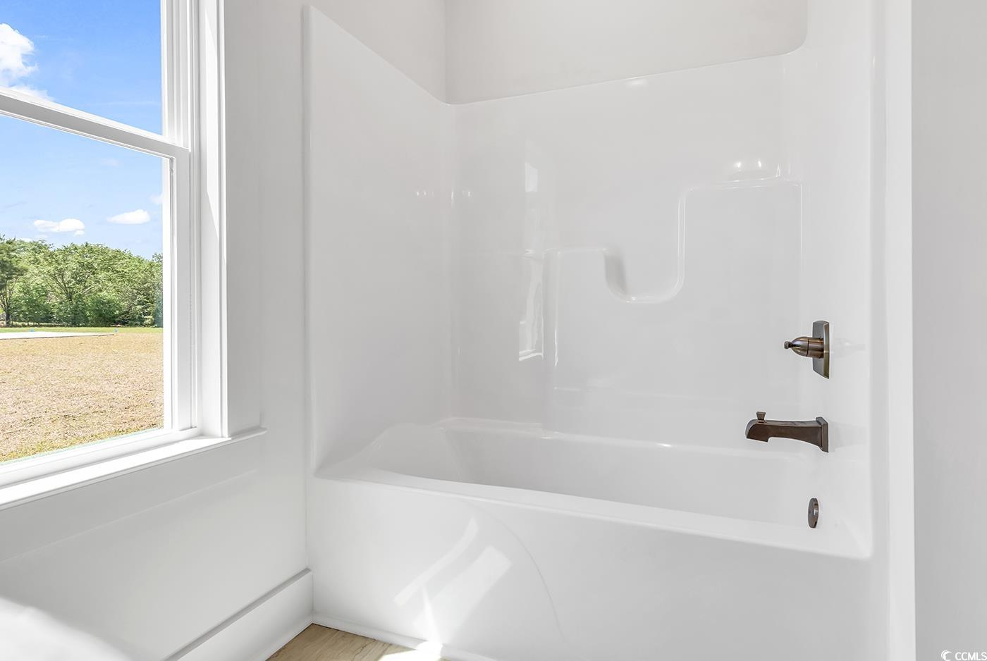 718 Highway 348 Loris, SC 29569 - Photo 26 of 28 Main Bathroom with tub/shower combination and window