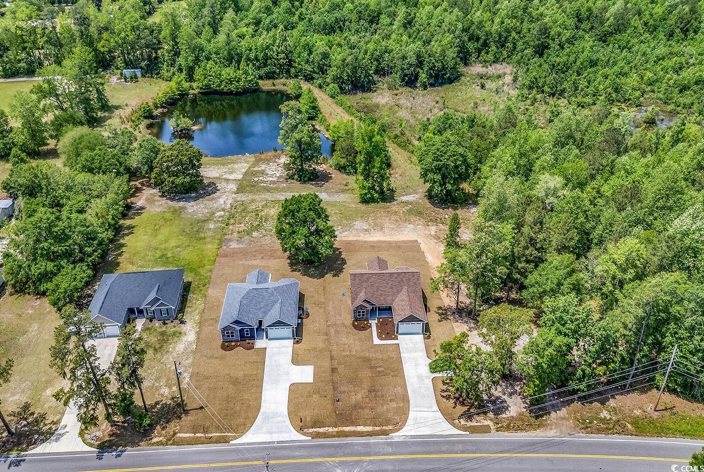 718 Highway 348 Loris, SC 29569 - Photo 4 of 28 Aerial view with a water view and a view of trees
