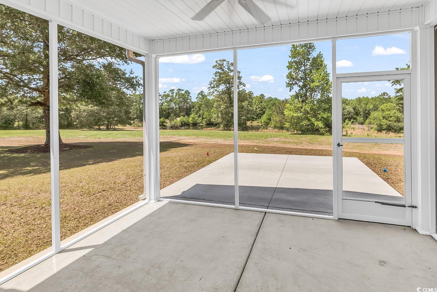 718 Highway 348 Loris, SC 29569 - Photo 6 of 28 Screened Porch featuring a ceiling fan