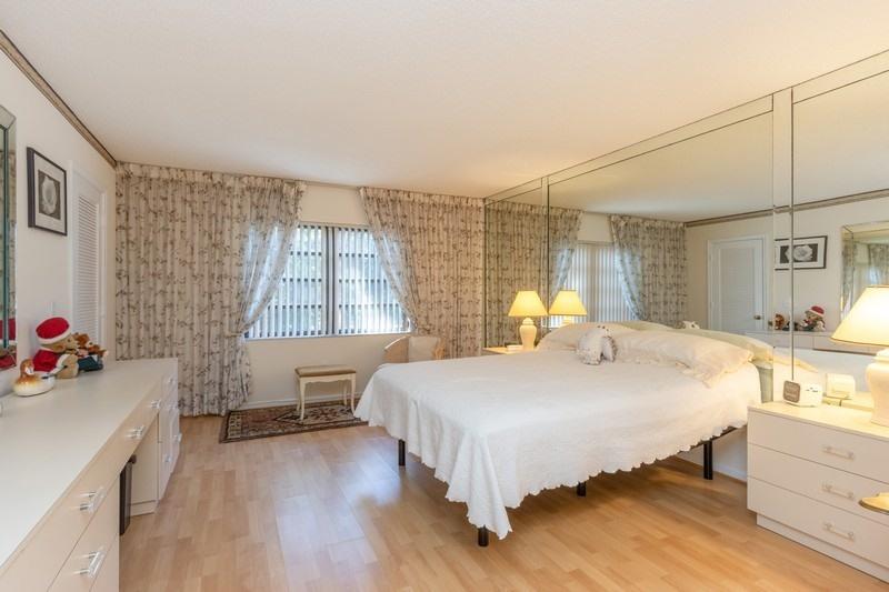 21699 Cypress Road, Unit 17E Boca Raton, FL 33433 - Photo 8 of 21 07_21699CypressRoad17E_14_MasterBedroom_