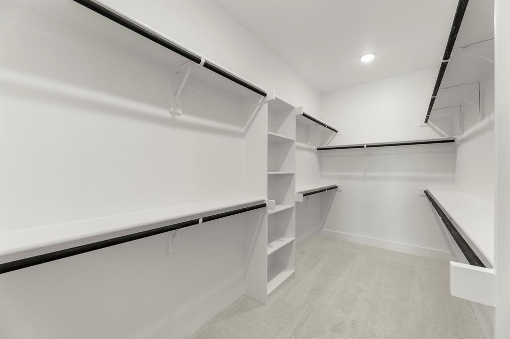 1285 Flamingo Road Forney, TX 75126 - Photo 32 of 40 a view of an empty walk in closet