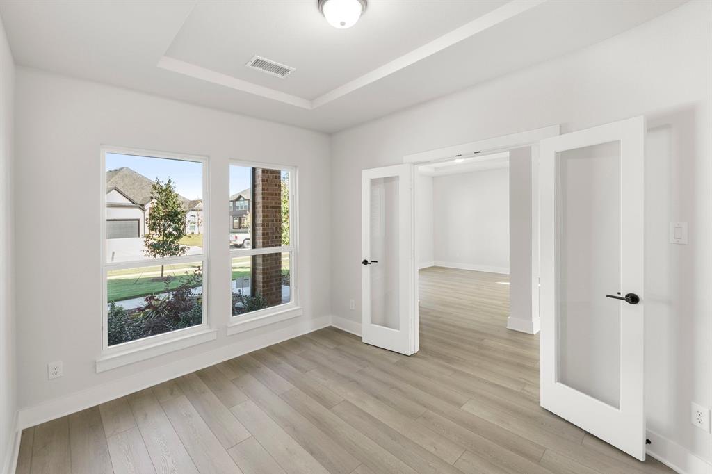 1285 Flamingo Road Forney, TX 75126 - Photo 8 of 40 wooden floor in an empty room