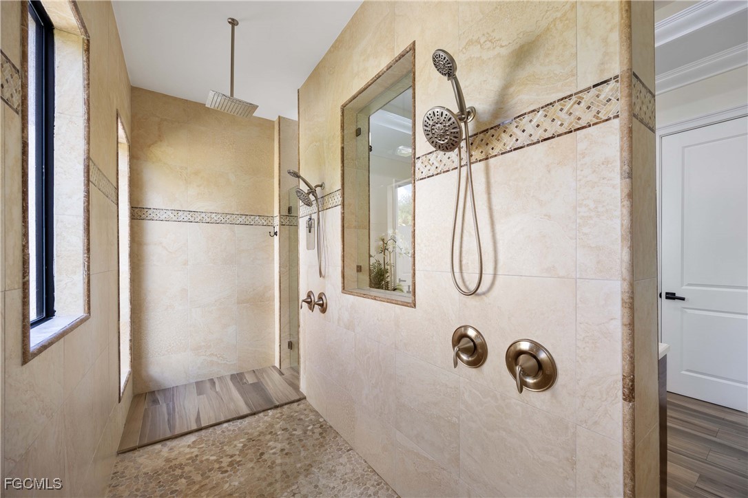 214 9th Street Northwest Naples, FL 34120 - Photo 25 of 49 a bathroom with a shower