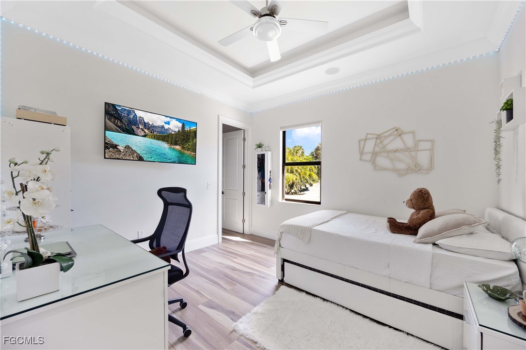 214 9th Street Northwest Naples, FL 34120 - Photo 26 of 49 a bedroom with furniture and a window