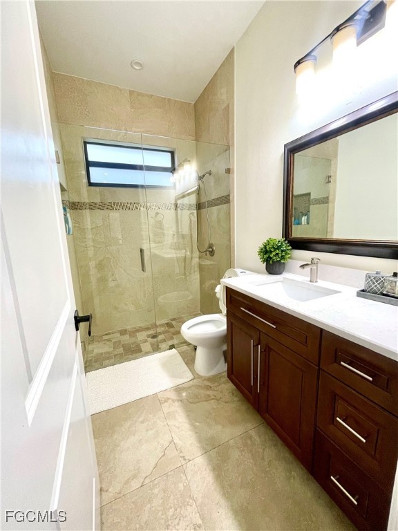 214 9th Street Northwest Naples, FL 34120 - Photo 31 of 49 a spacious bathroom with a bathtub shower sink mirror and toilet