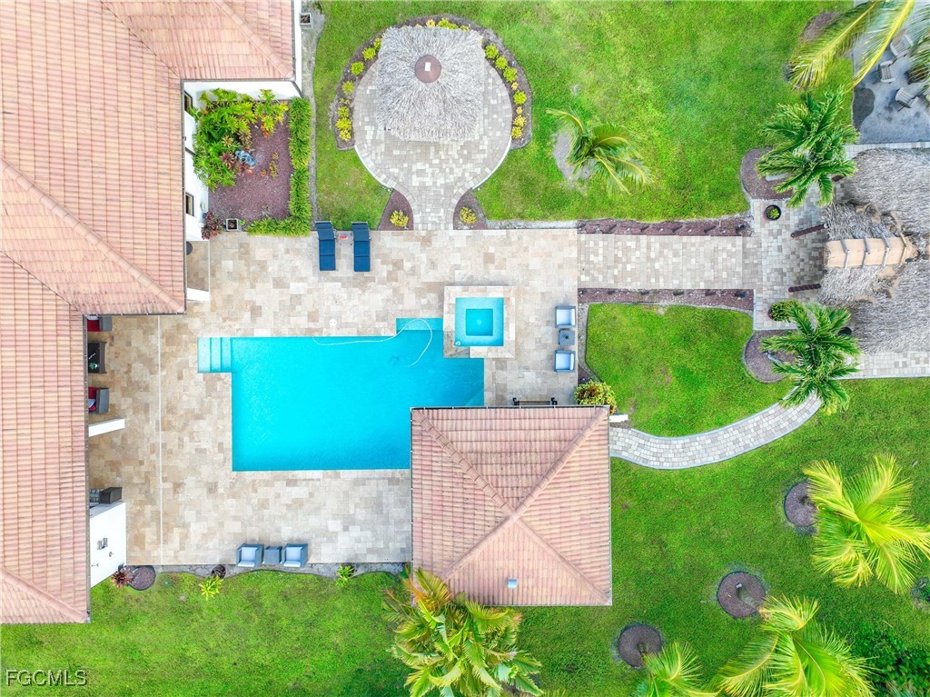 214 9th Street Northwest Naples, FL 34120 - Photo 34 of 49 a front view of a house with garden