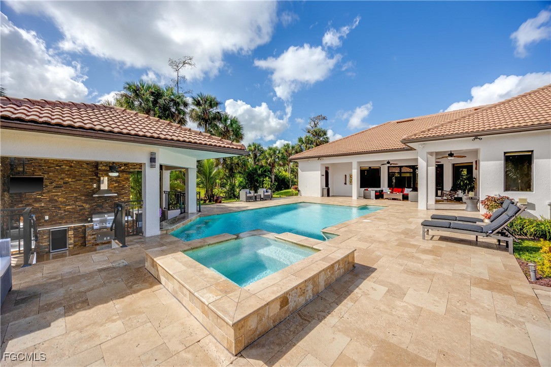 214 9th Street Northwest Naples, FL 34120 - Photo 37 of 49 a view of house with swimming pool and sitting area