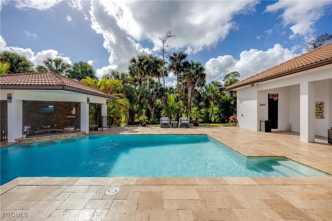 214 9th Street Northwest Naples, FL 34120 - Photo 39 of 49 a view of a house with entertaining space