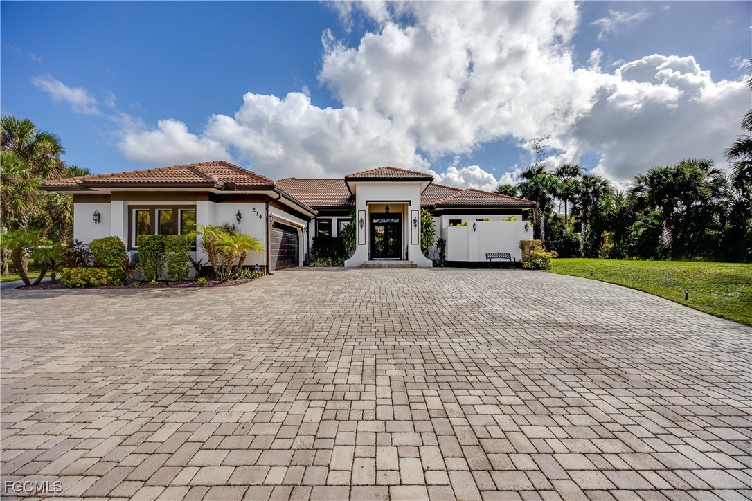 214 9th Street Northwest Naples, FL 34120 - Photo 49 of 49 front view of house with a yard