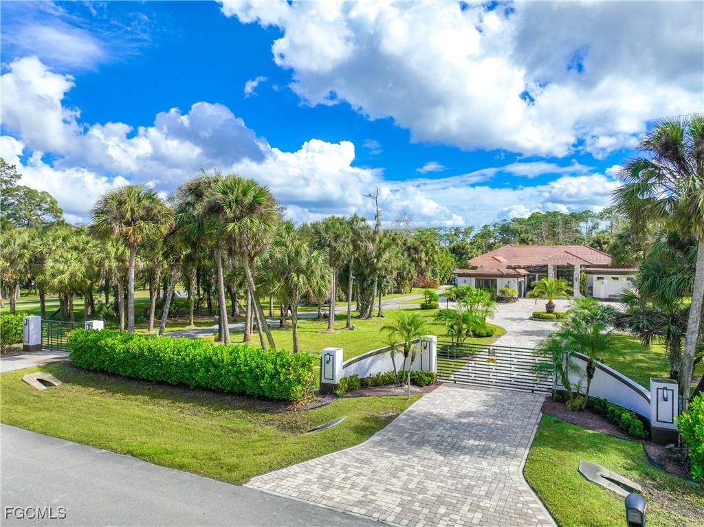214 9th Street Northwest Naples, FL 34120 - Photo 6 of 49 a view of a swimming pool with a patio