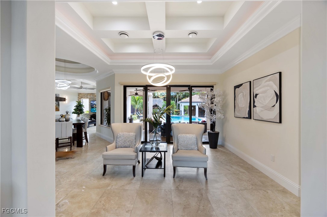 214 9th Street Northwest Naples, FL 34120 - Photo 10 of 49 a living room with furniture and a large window